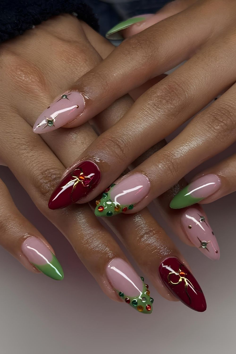 Soft pink mani with red and green festive accents