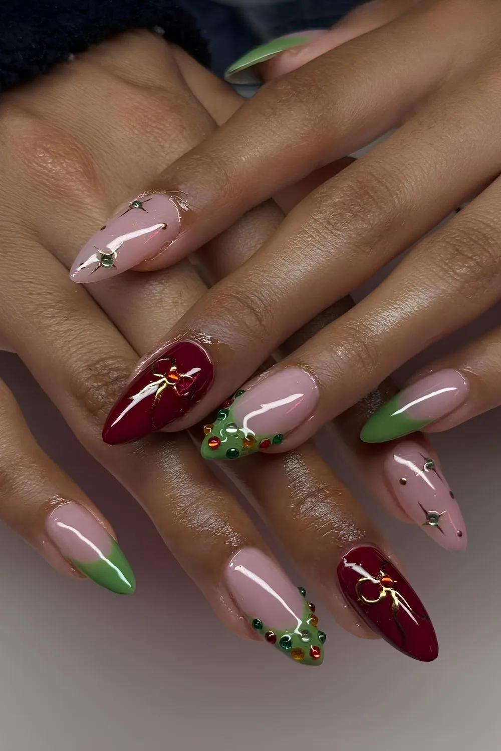 Soft pink mani with red and green festive accents