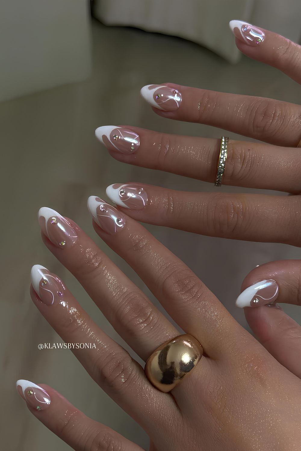 Swirly white French nails with chrome finish