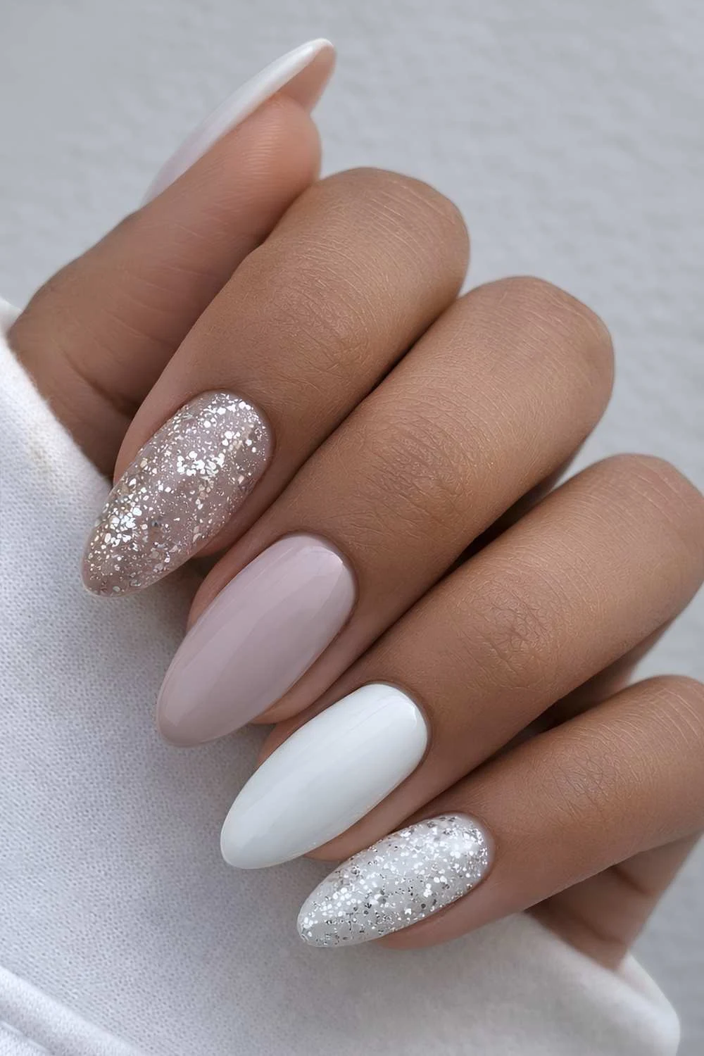 Taupe and white nails with accent glitter