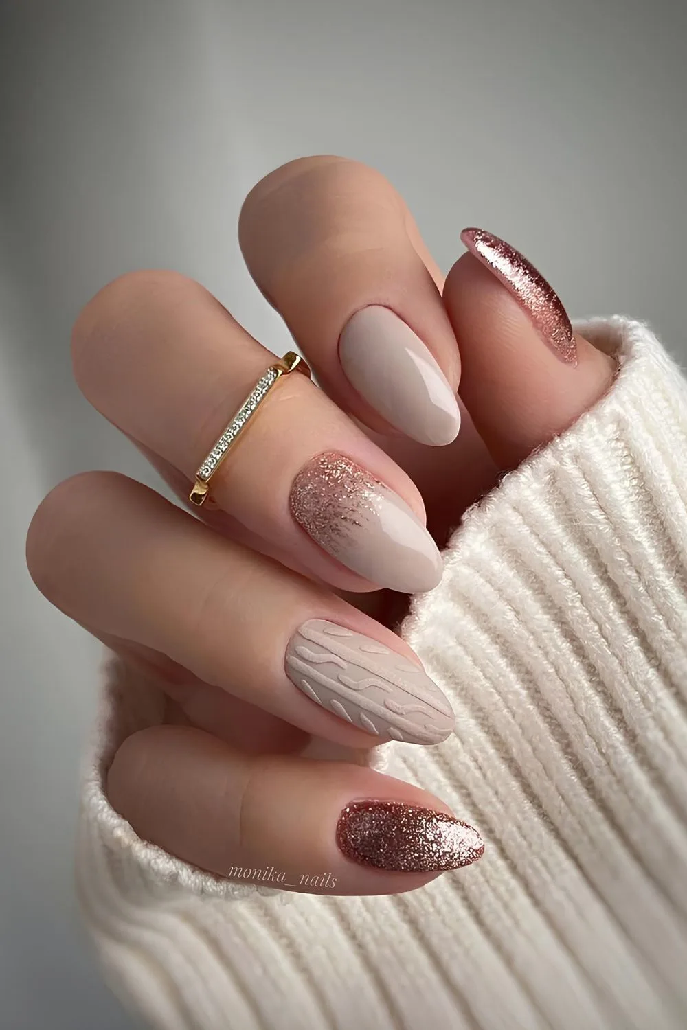 Taupe nails with glitter and sweater pattern art