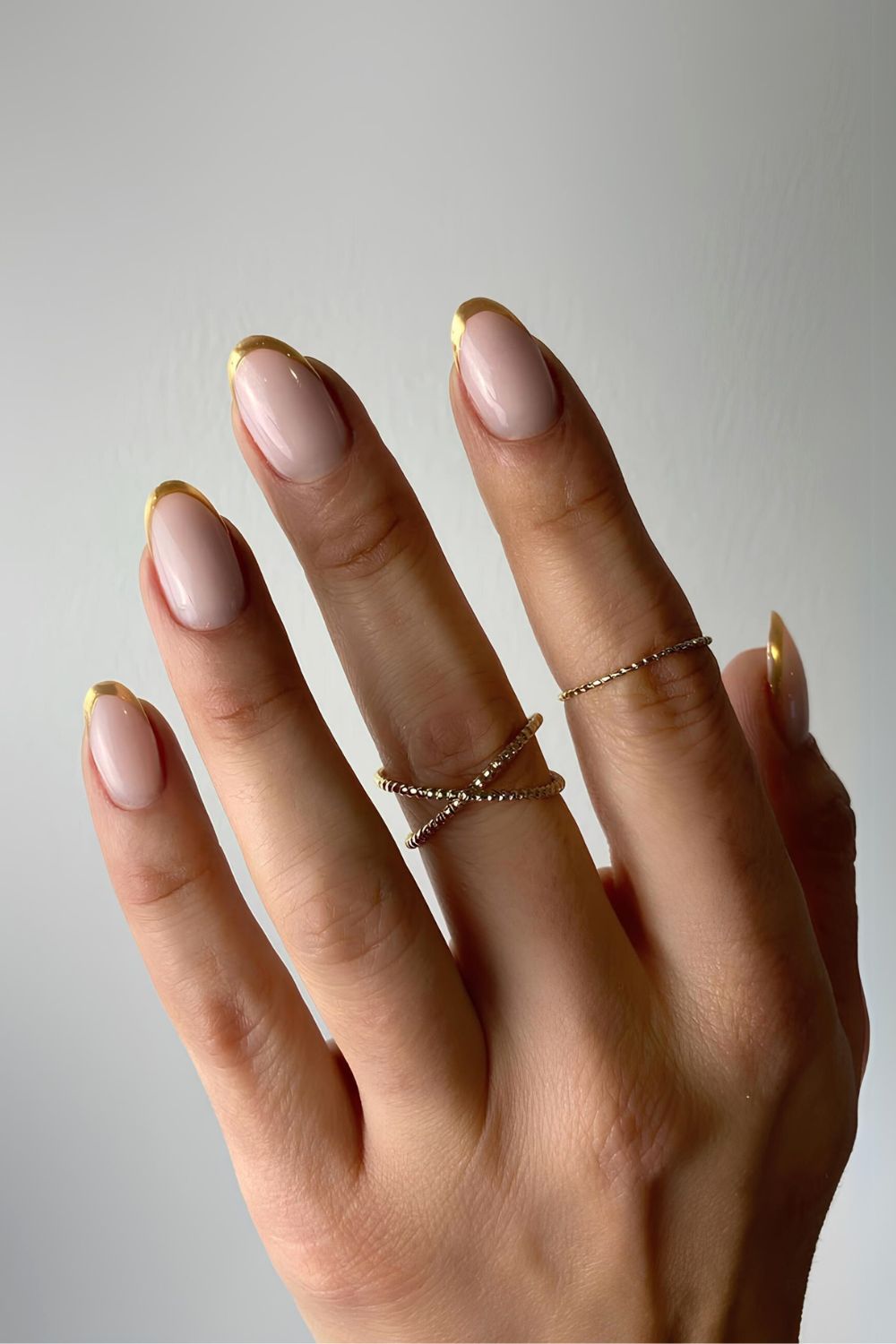 Thin golden French tip manicure