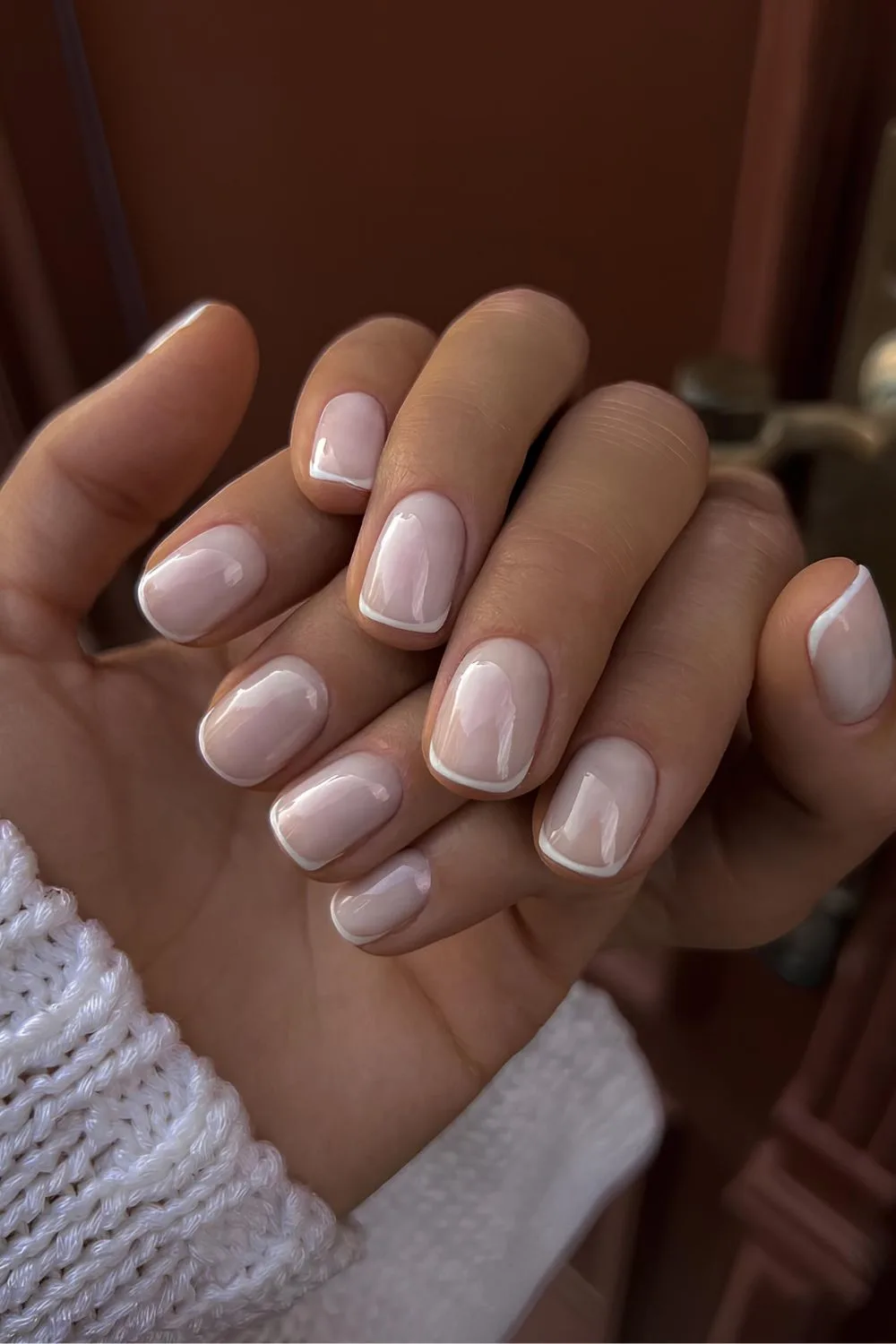 Thin white French tip mani on milky base