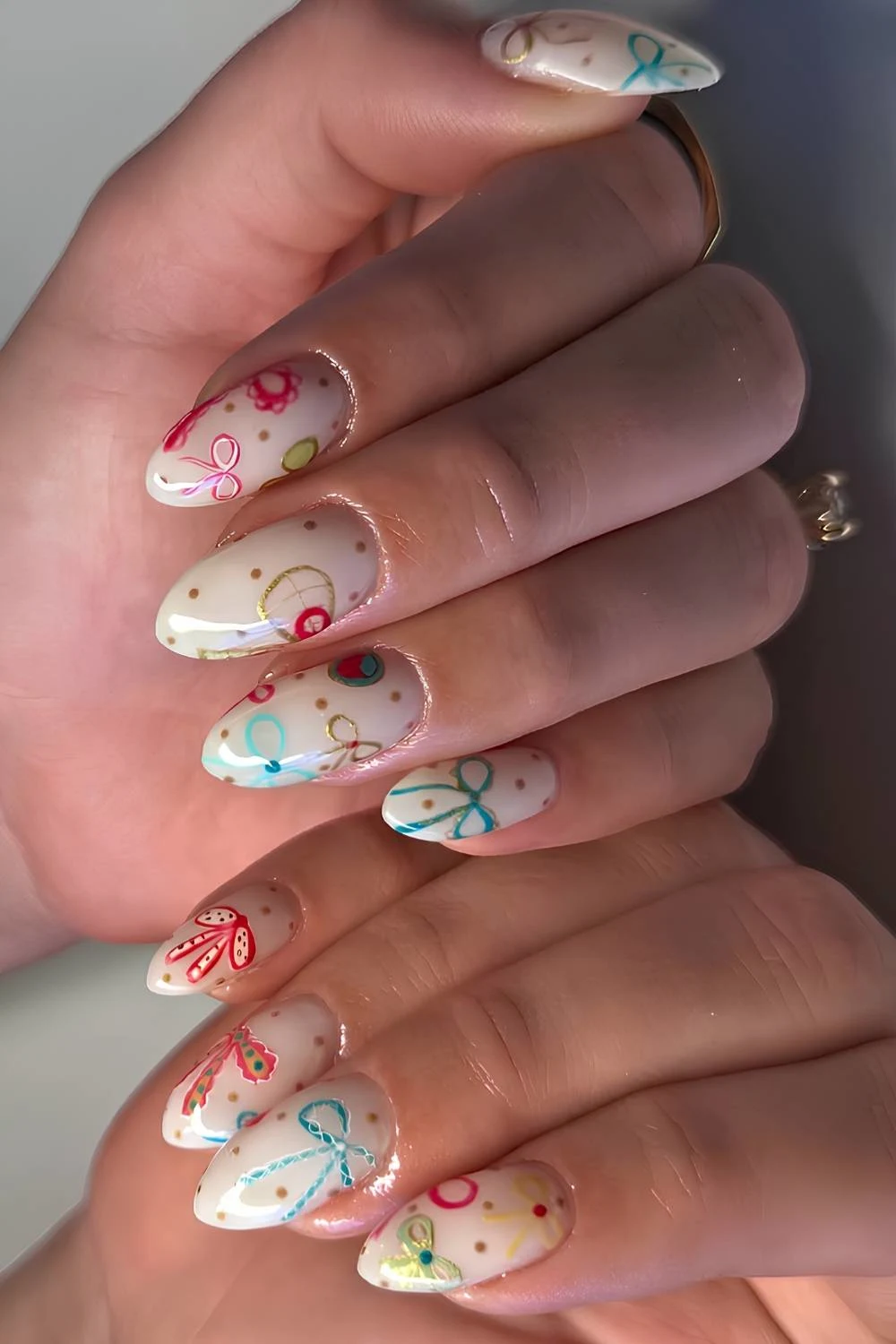 White Christmas nails with colorful bows