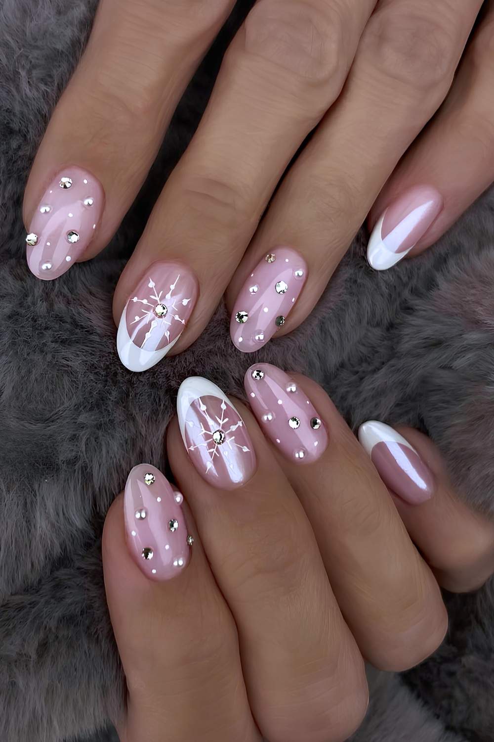 White French nails with gems and snowflakes