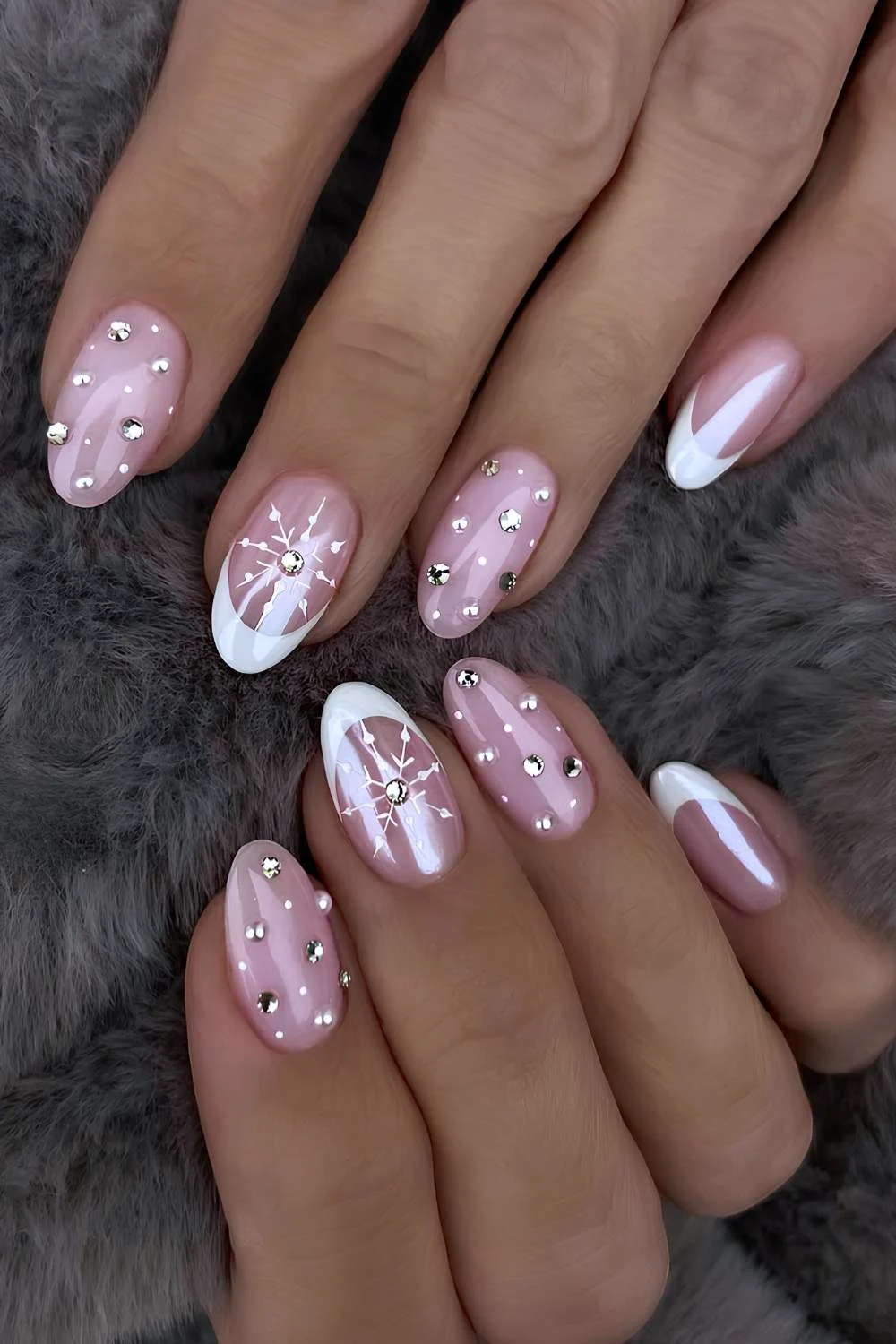 White French nails with gems and snowflakes