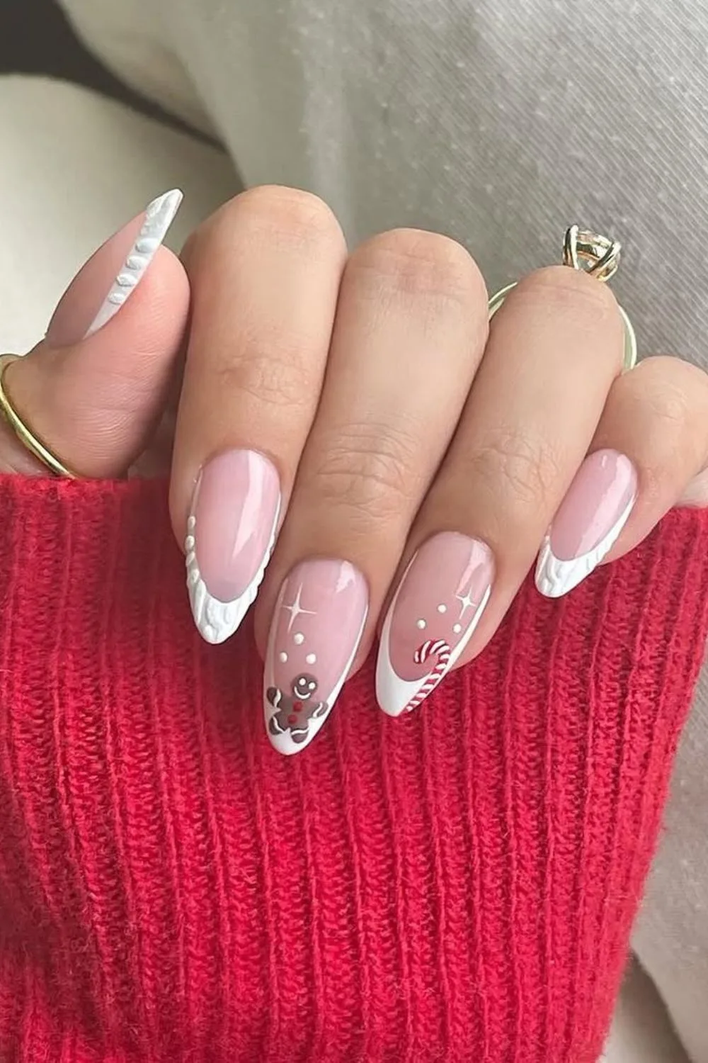 White French tip nails with candy cane and gingerbread accent