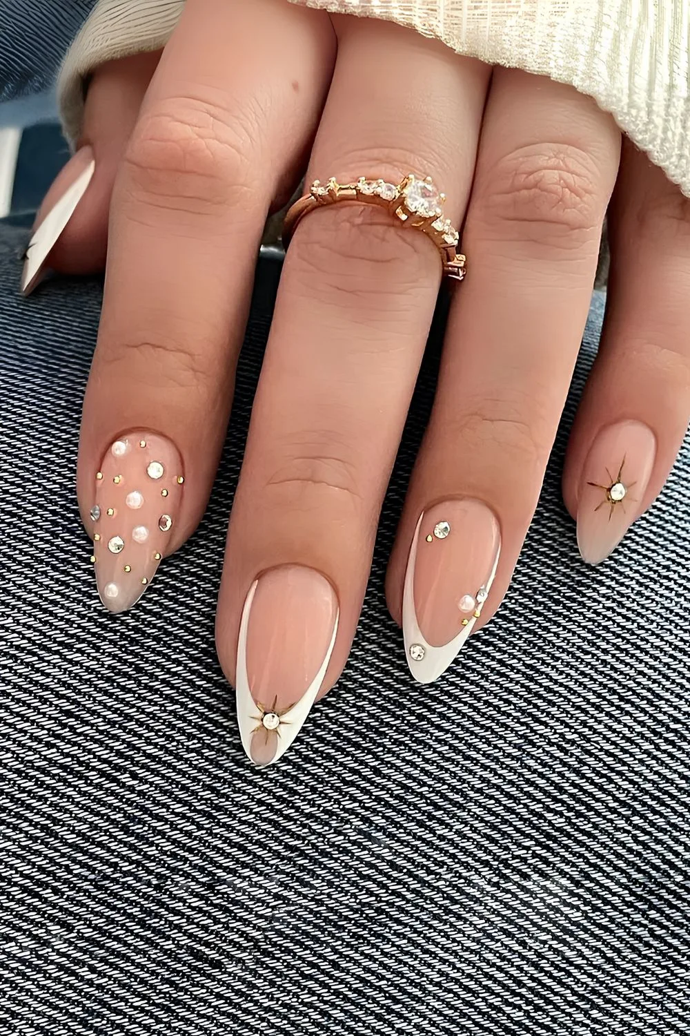 White French tip nails with pearls and rhinestones