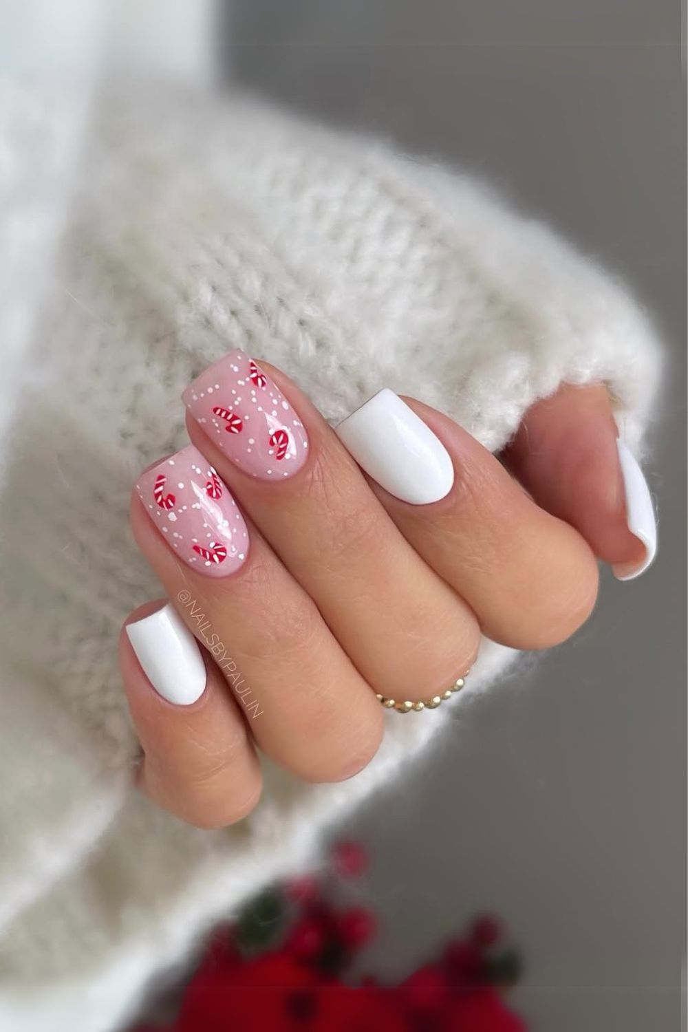 White and pink nails with candy cane accents