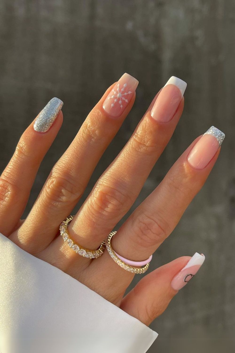 White and silver French nails with snowflakes