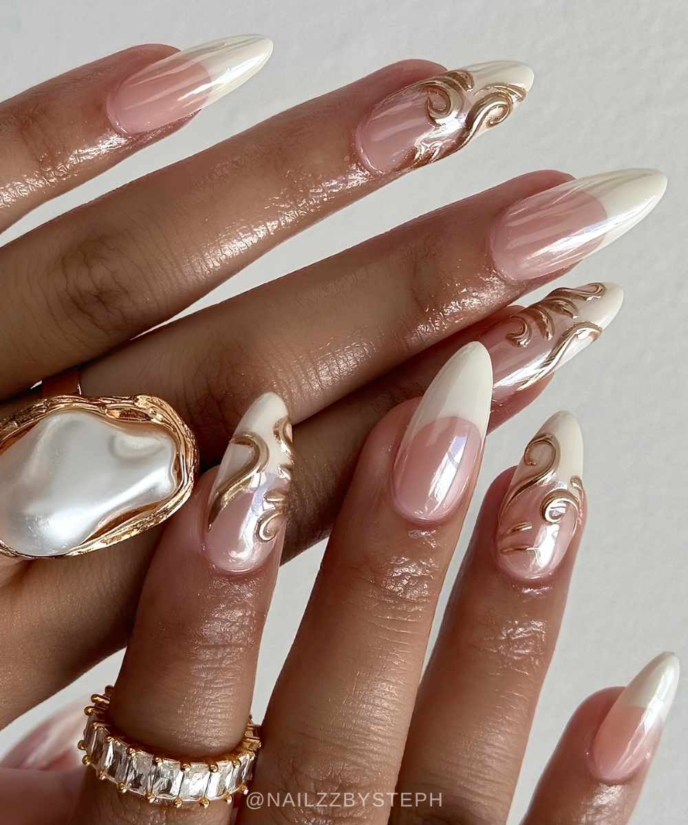 White chrome French mani with gold textured swirls