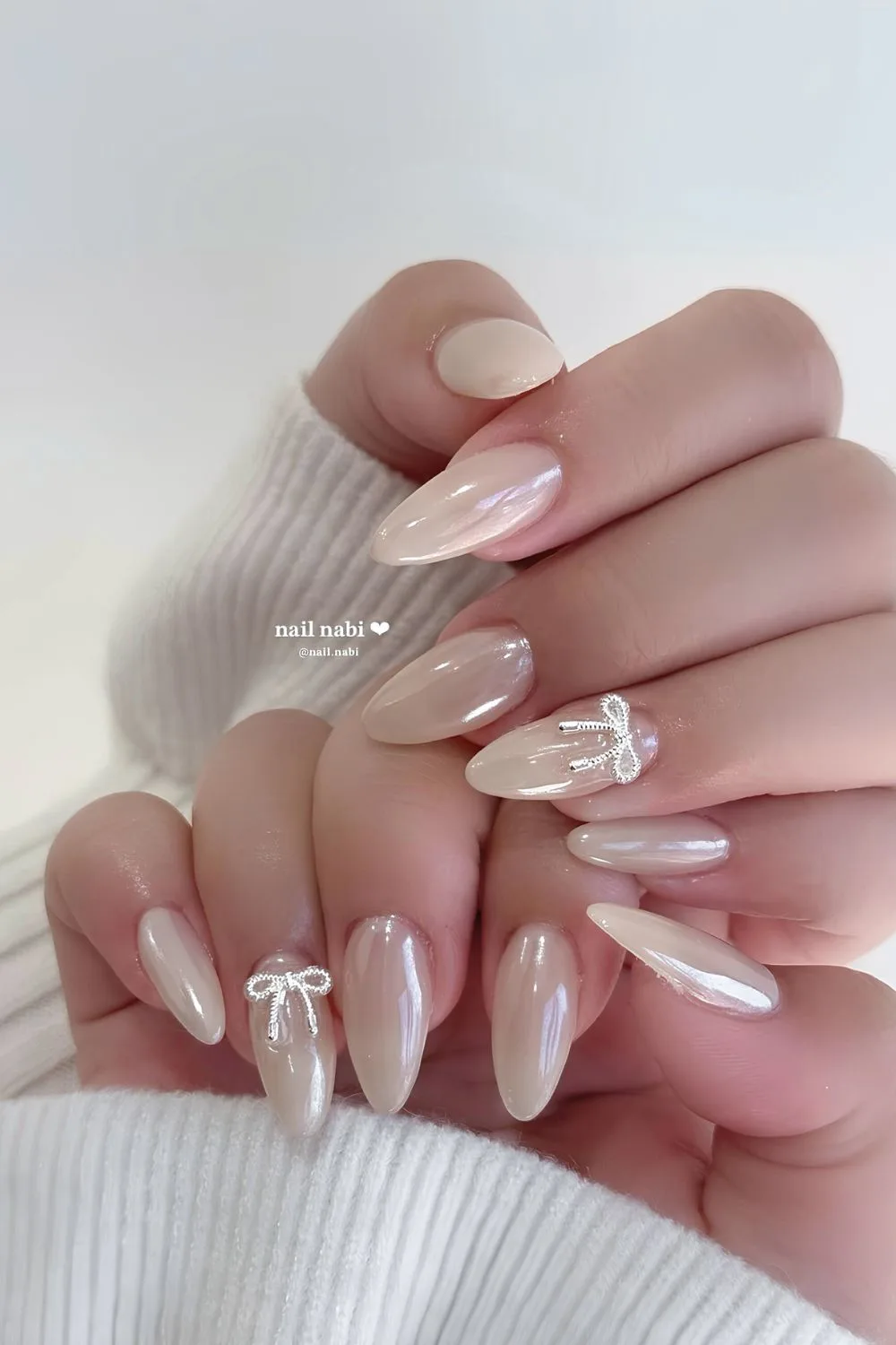 White chrome nails with 3d bows