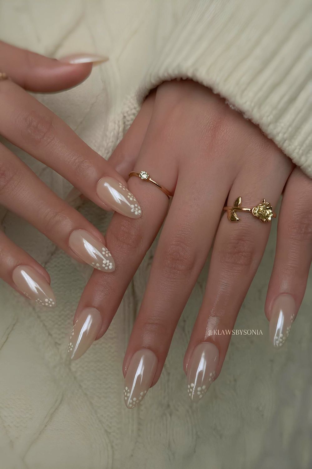 White chrome nails with floral accents