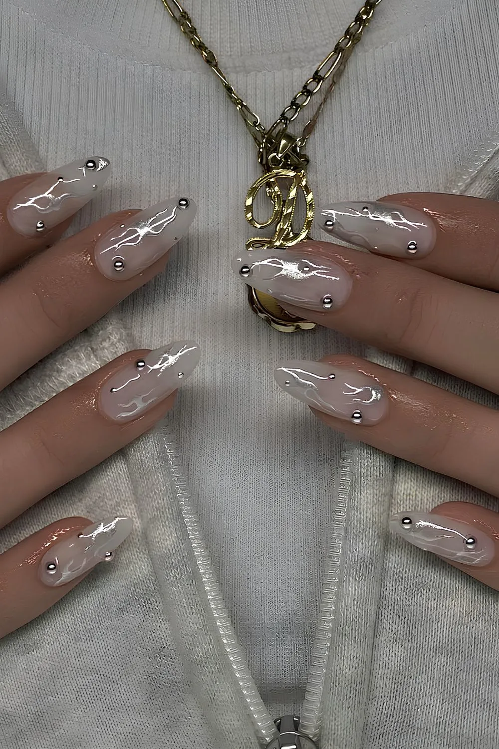 White chrome nails with silver accents