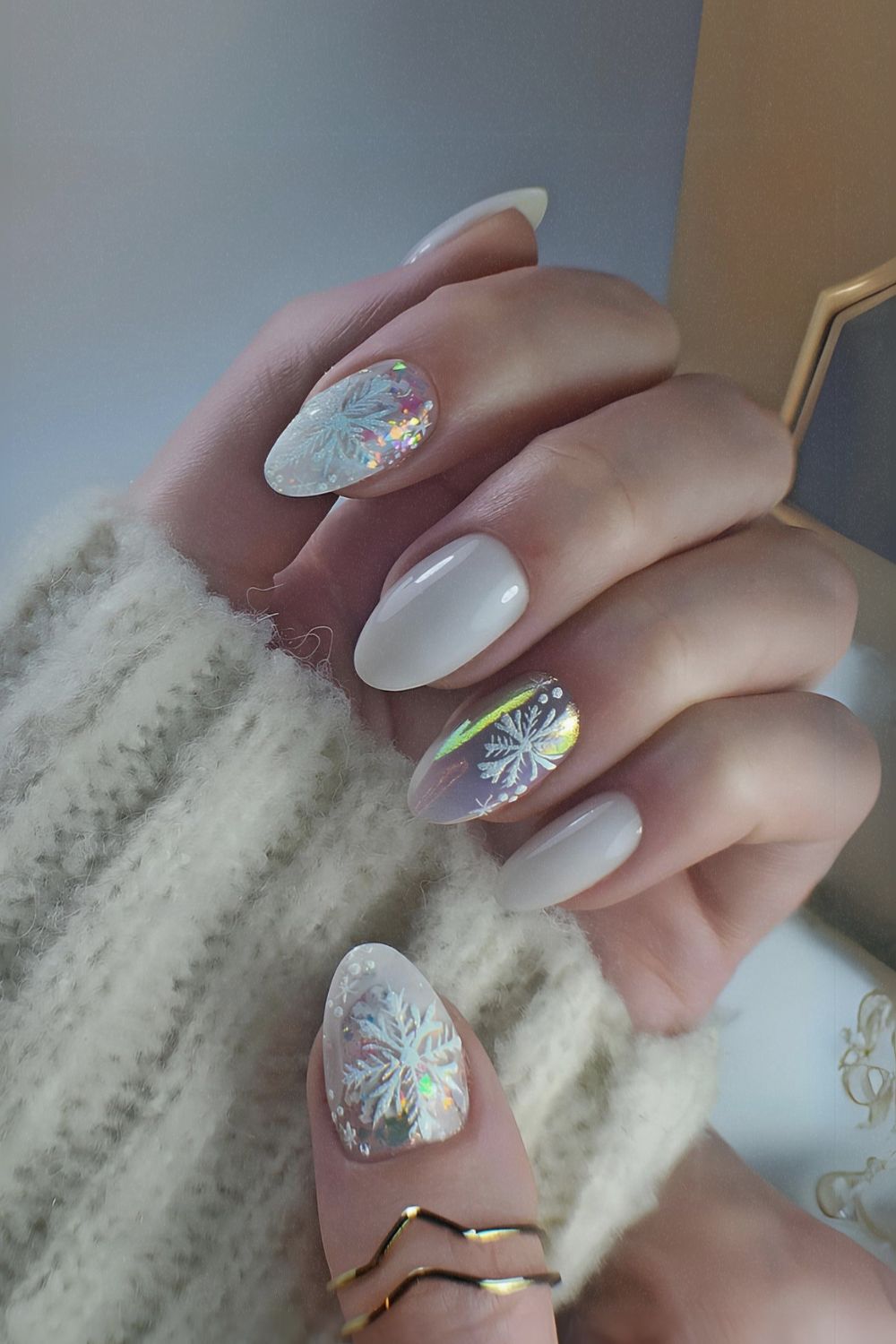 White chrome nails with snowflake accents