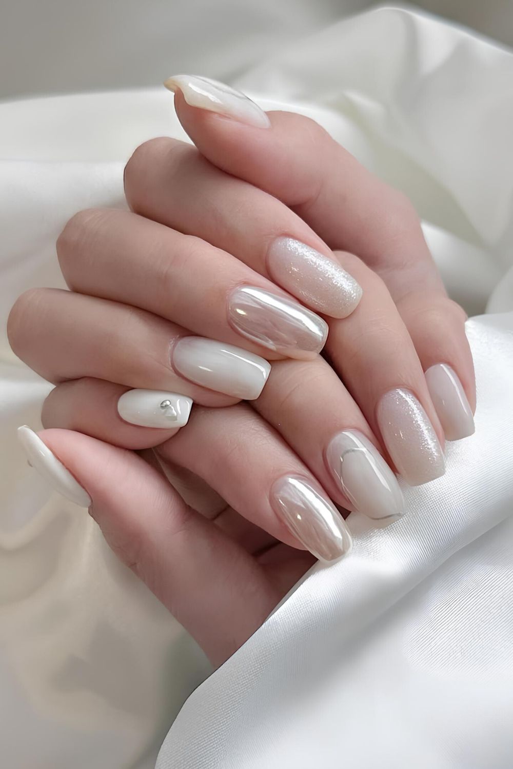 White mani with chrome and glitter accents