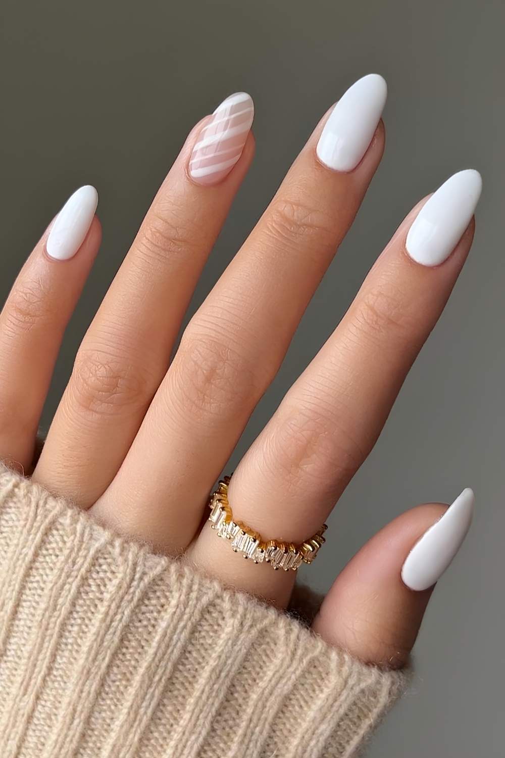 White nails with candy cane inspired stripes