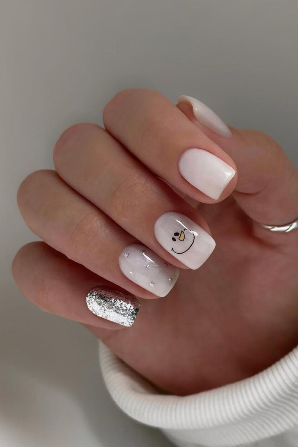 White nails with snowman face art