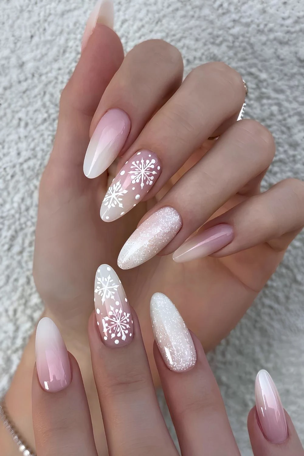 White ombre nails with glitter and snowflakes