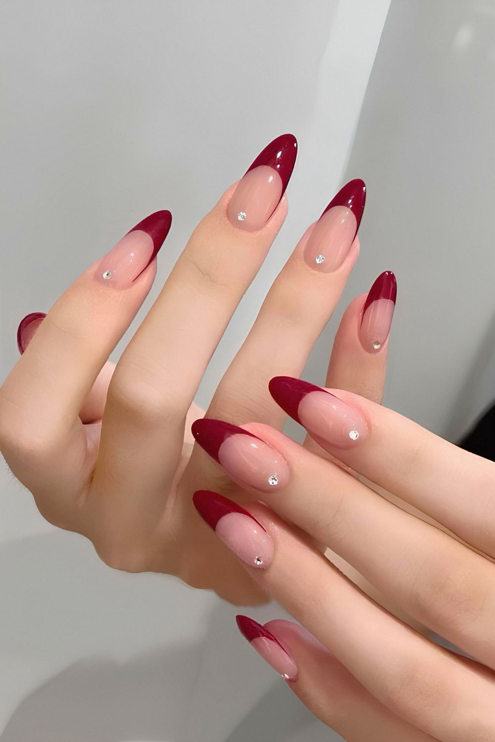 Wine red French nails with rhinestones