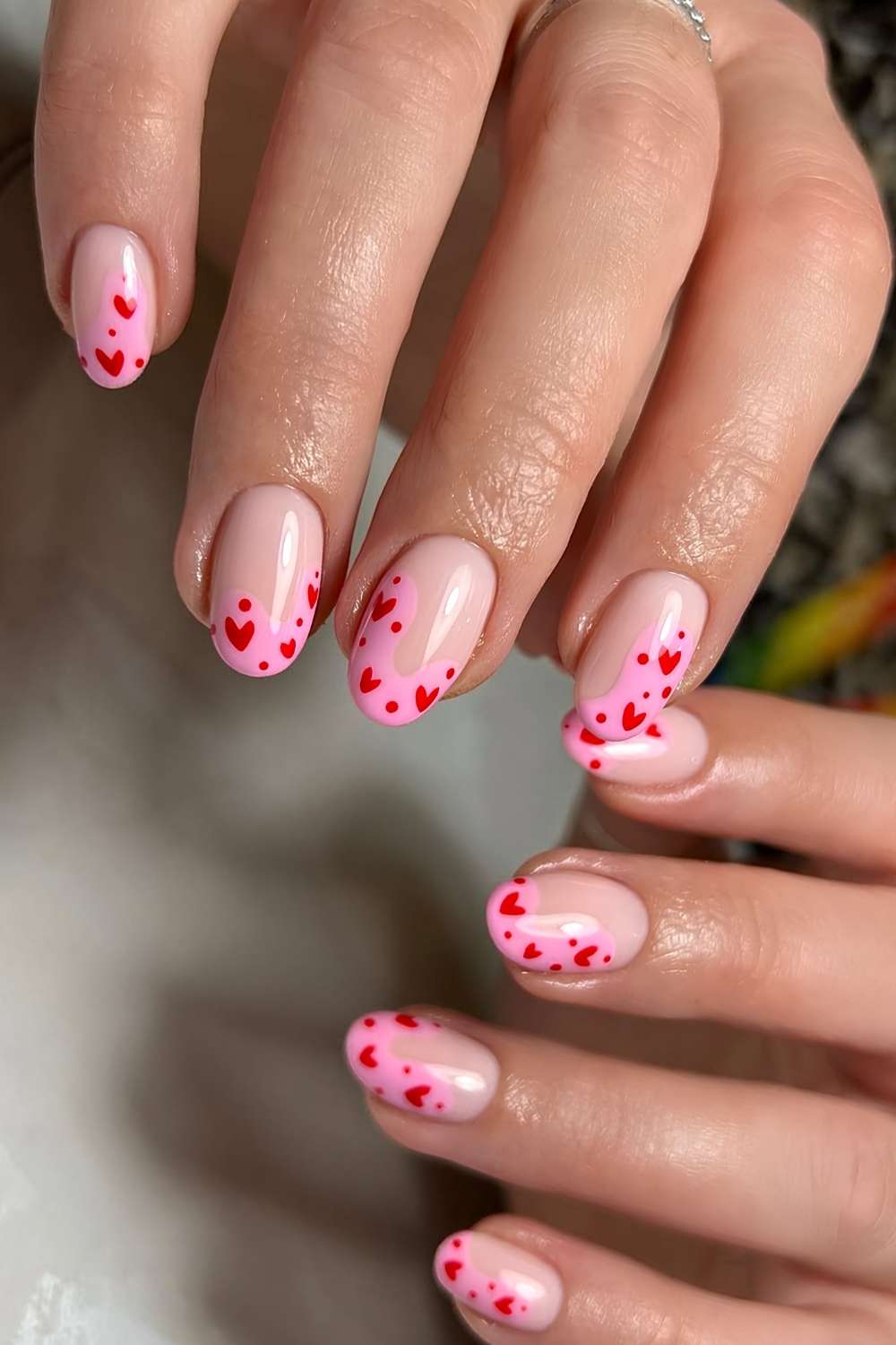Abstract pink French nails with hearts