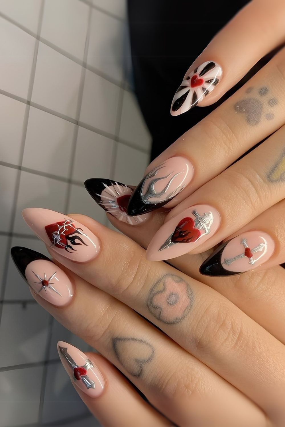 Black French Valentine nails with goth accents