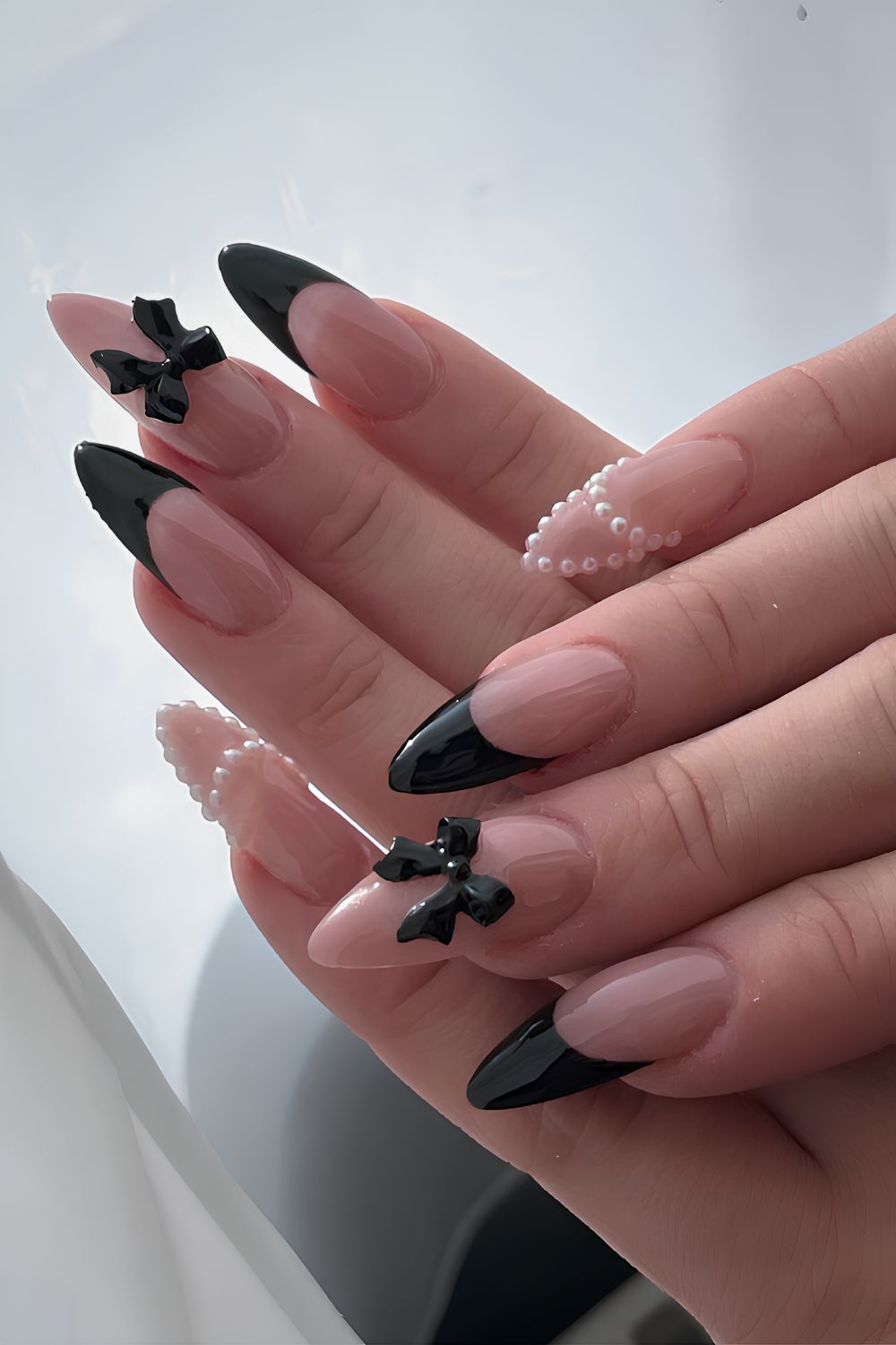 Black French mani with pearls and bows