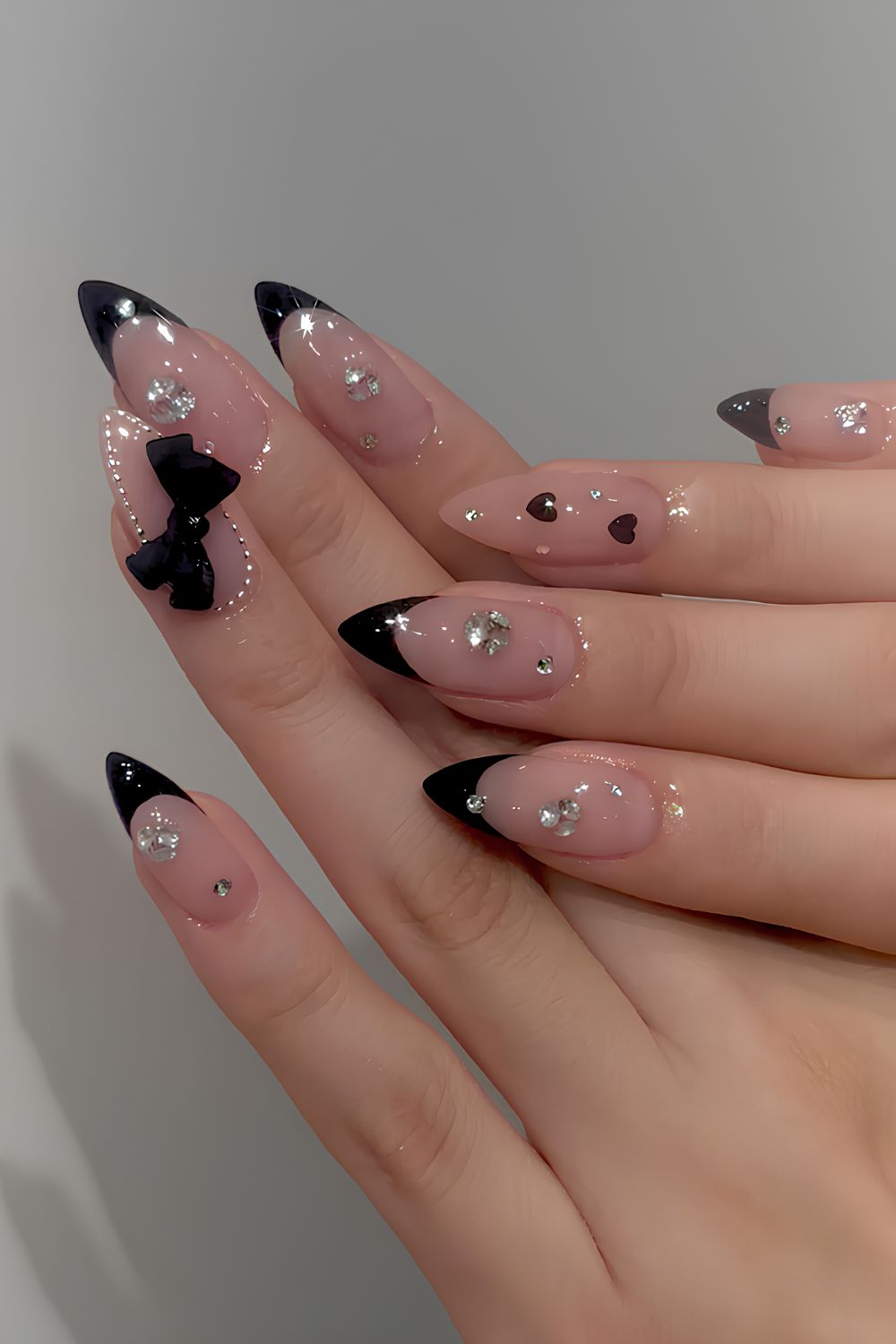 Black French nails with 3D bows and gems