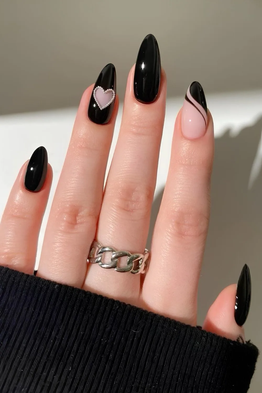 Black nails with diamond heart and swirls