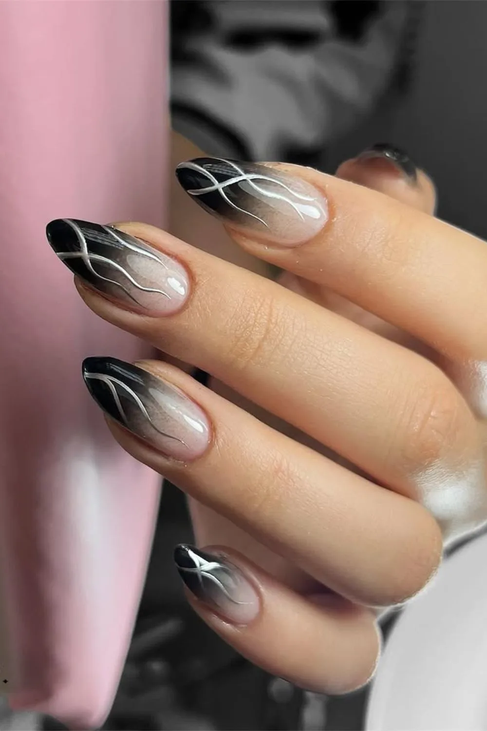 Black ombre nails with silver chrome swirls