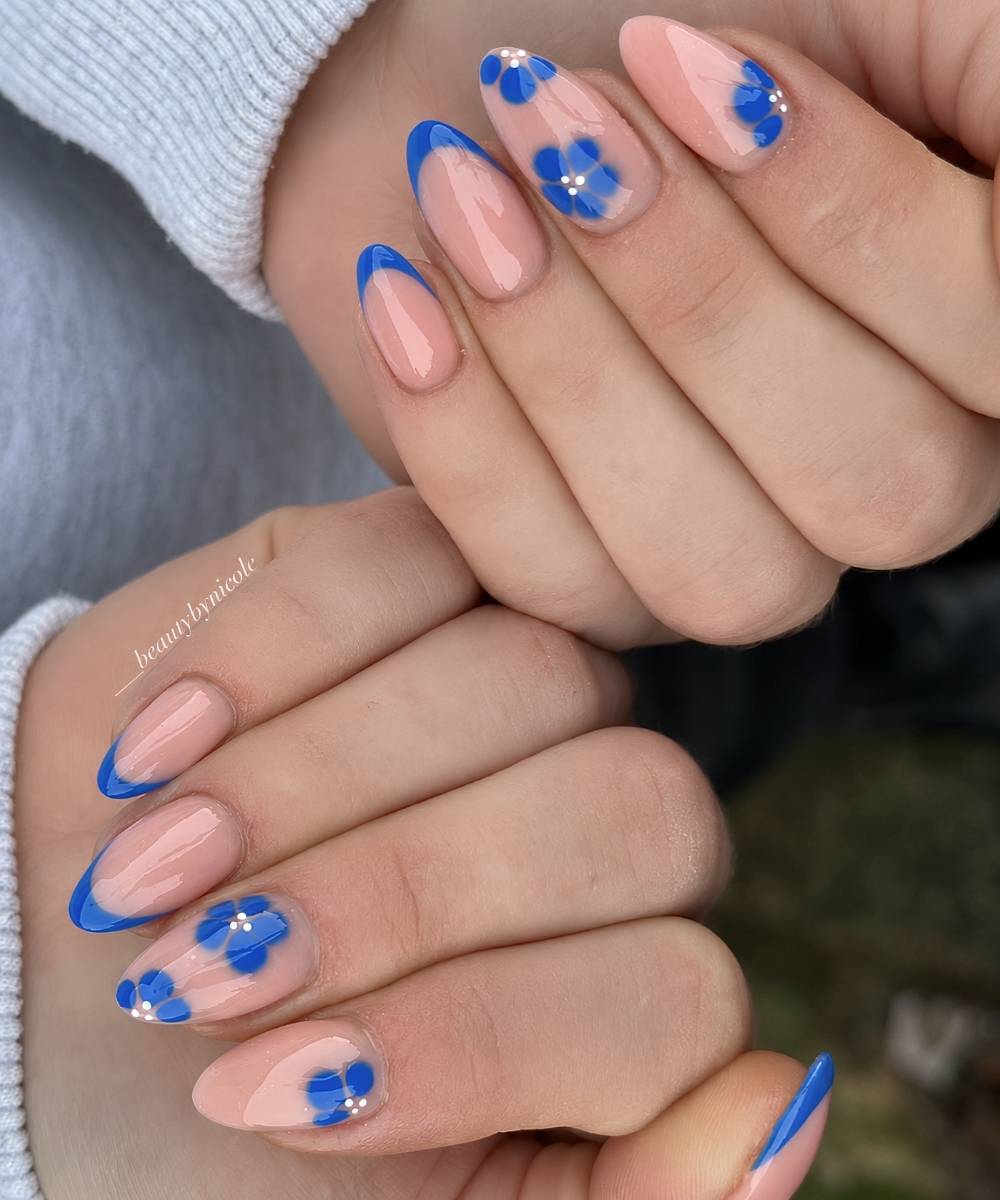 Blue French mani with blooming gel florals