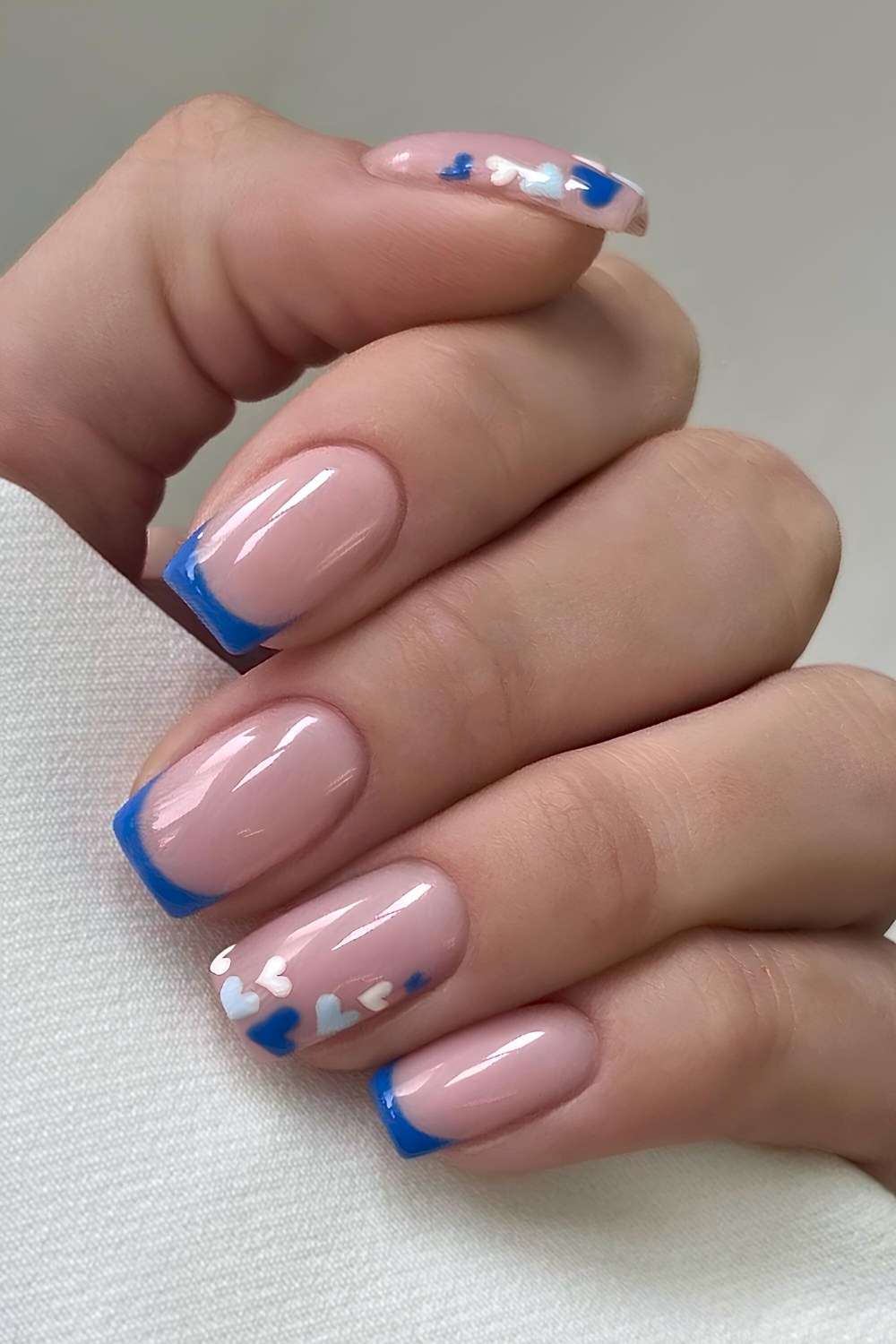 Blue French manicure with micro hearts