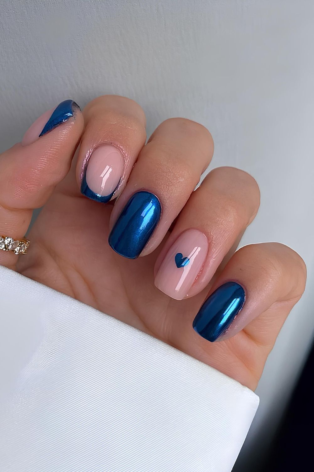 Blue chrome solid and French mix nails with heart accent