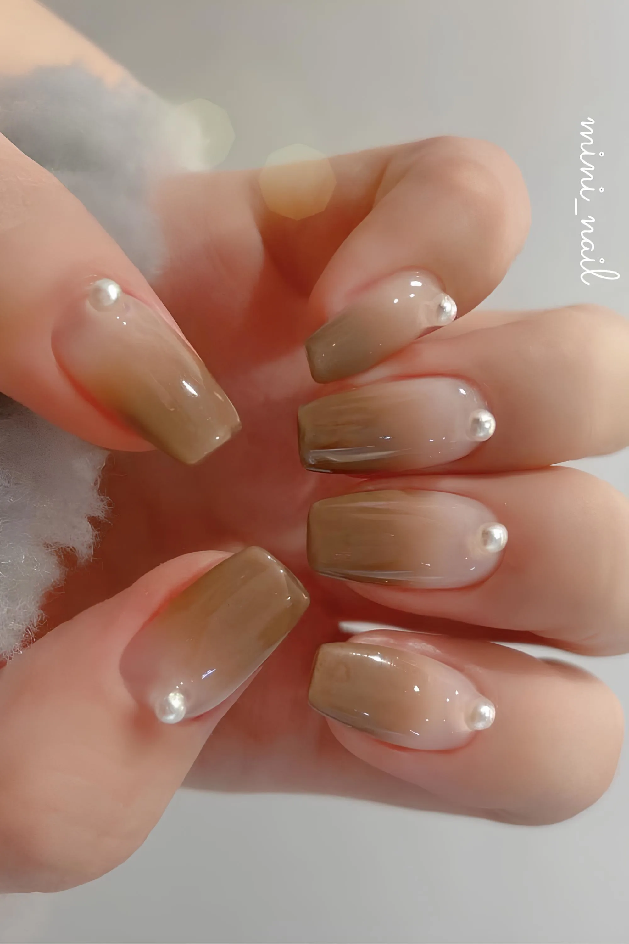 Brown Ombre nails with pearl accent