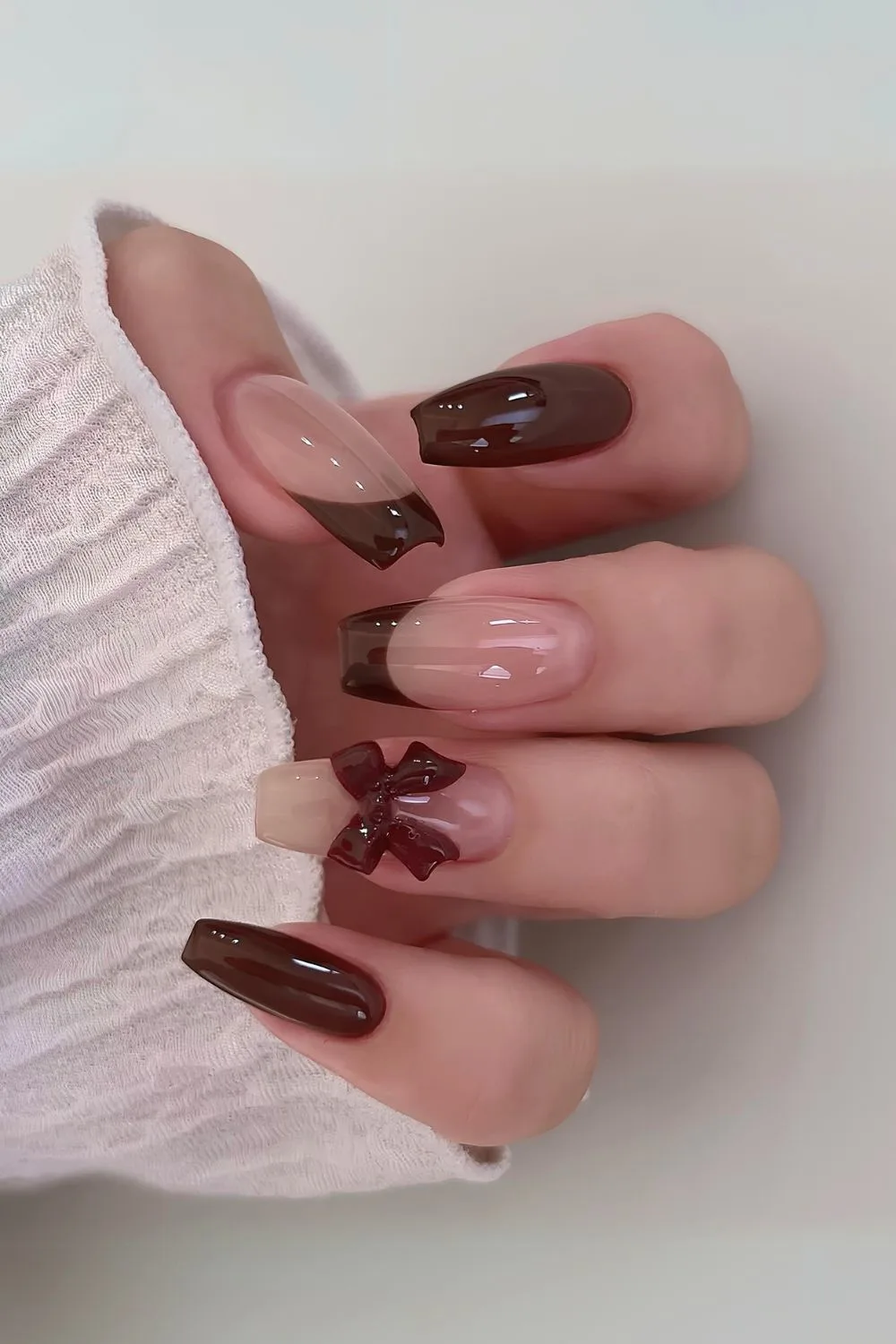 Brown coquette French mani with bows