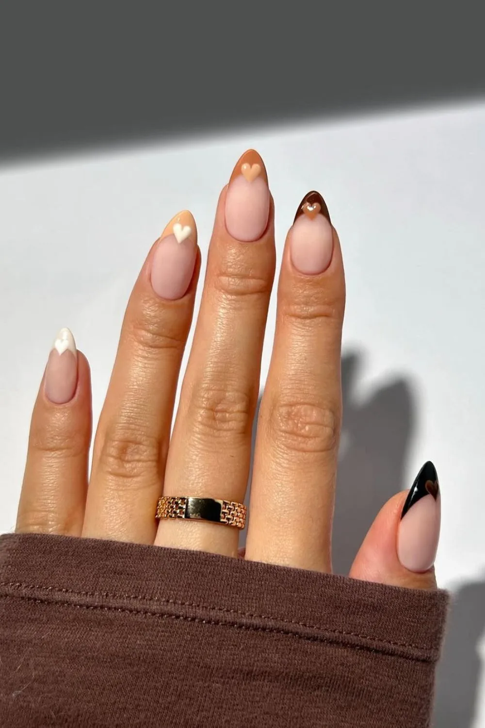 Brown gradient French tip nails with heart accents