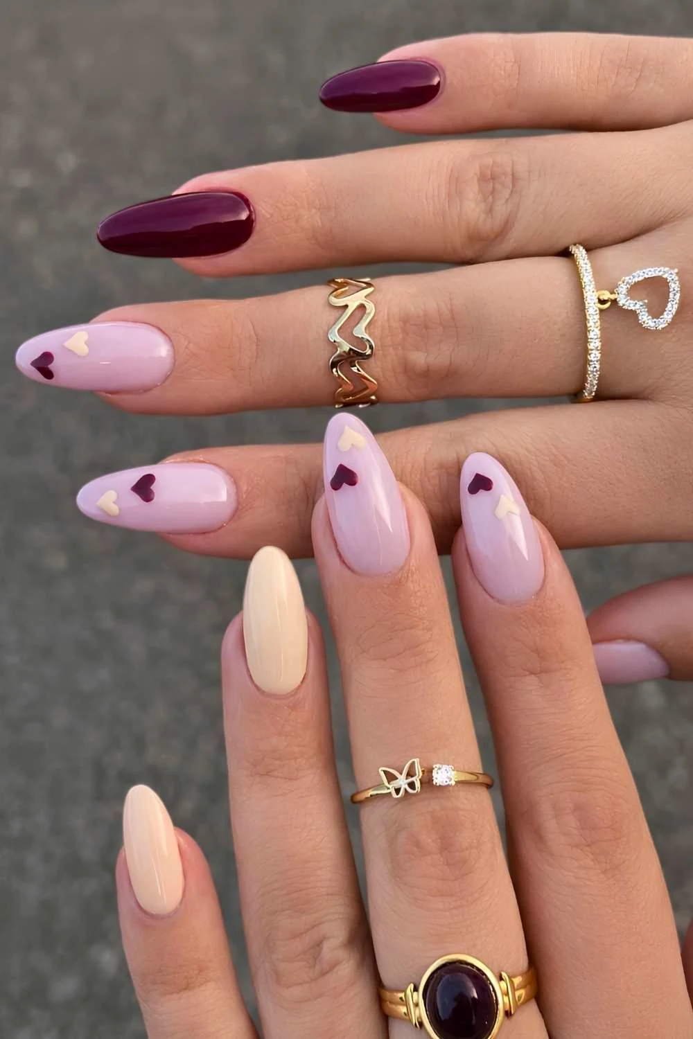 Burgundy and pink heart nails