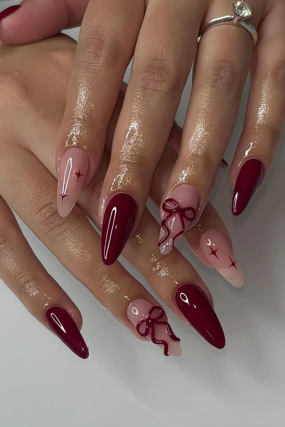 Burgundy coquette mani with 3D bows