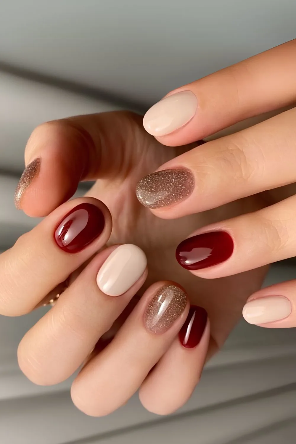 Burgundy nails with white and glitter accents