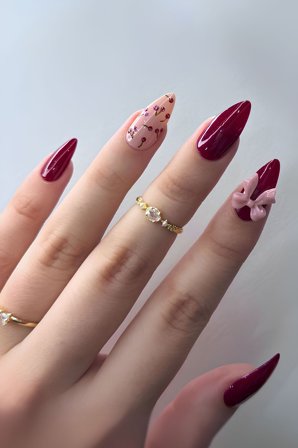 Burgundy red mani with blush pink accents