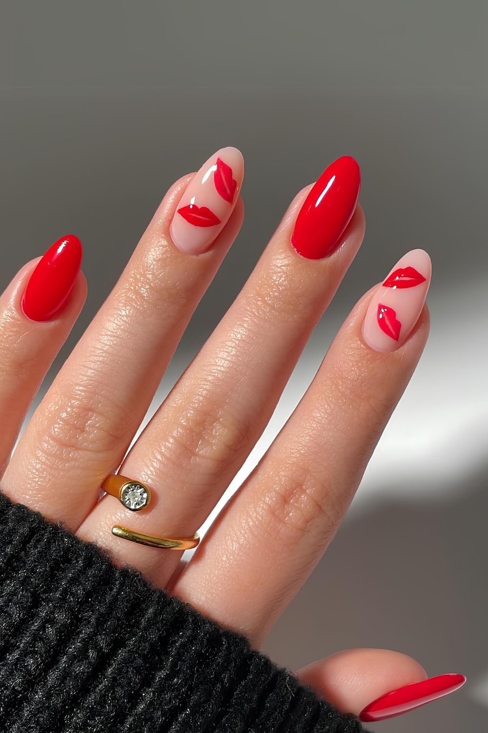 Classic red nails with kissy lips accents