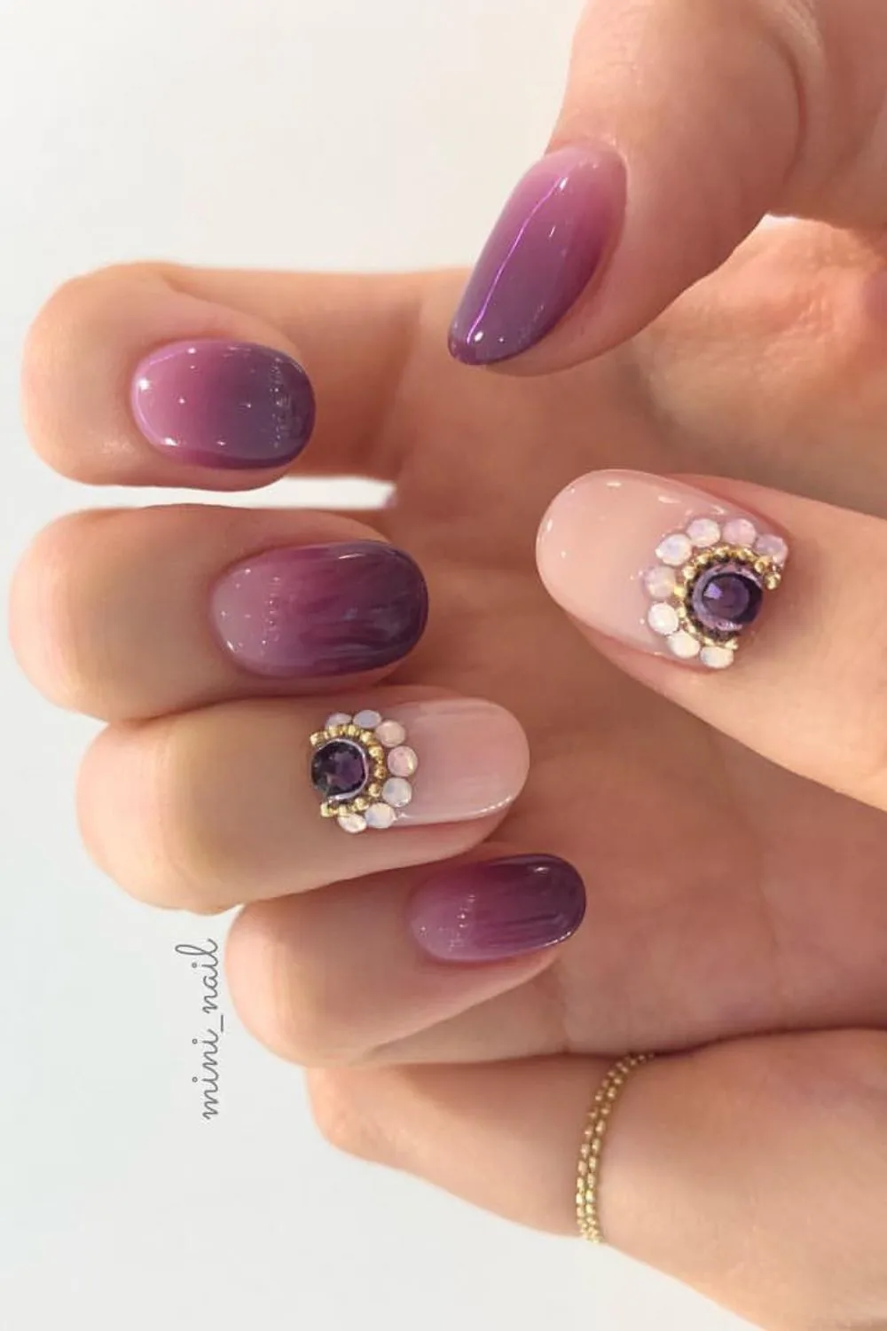 Dark Purple Ombre nails with crystal accents