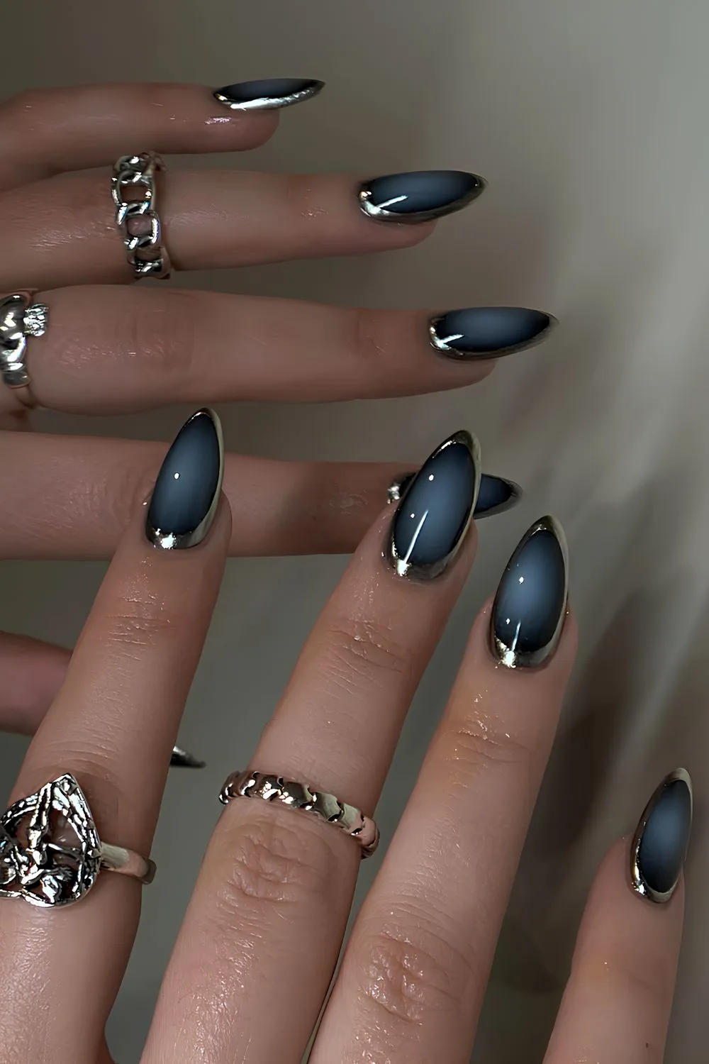 Dark blue aura nails with silver chrome outline