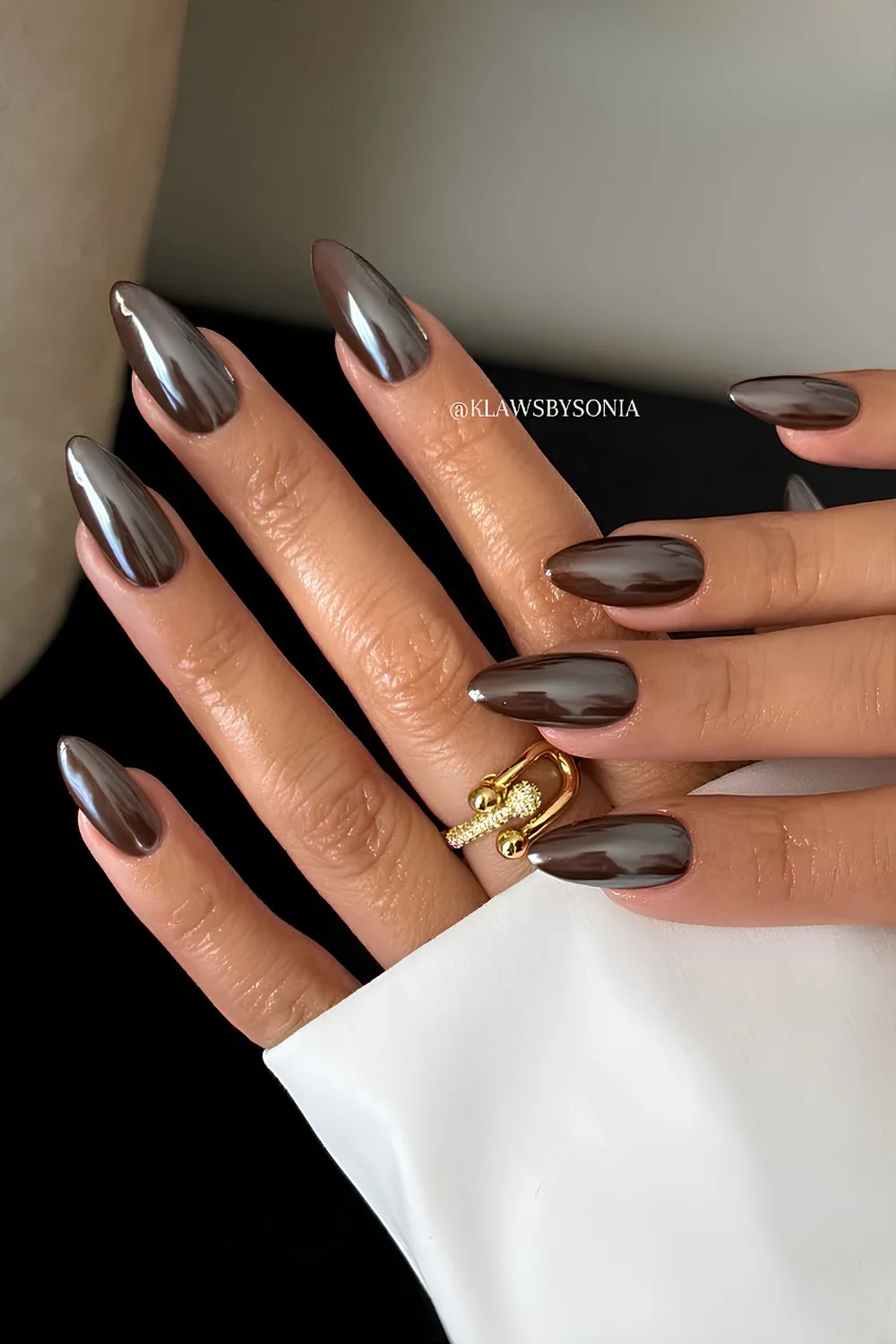 Dark brown chrome manicure