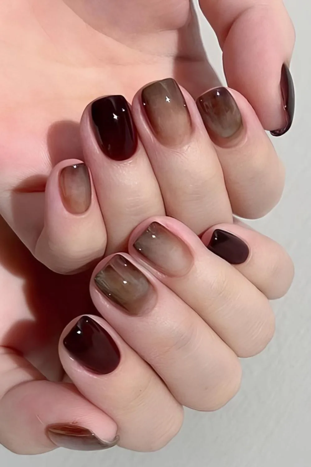 Dark brown marble ombre nails