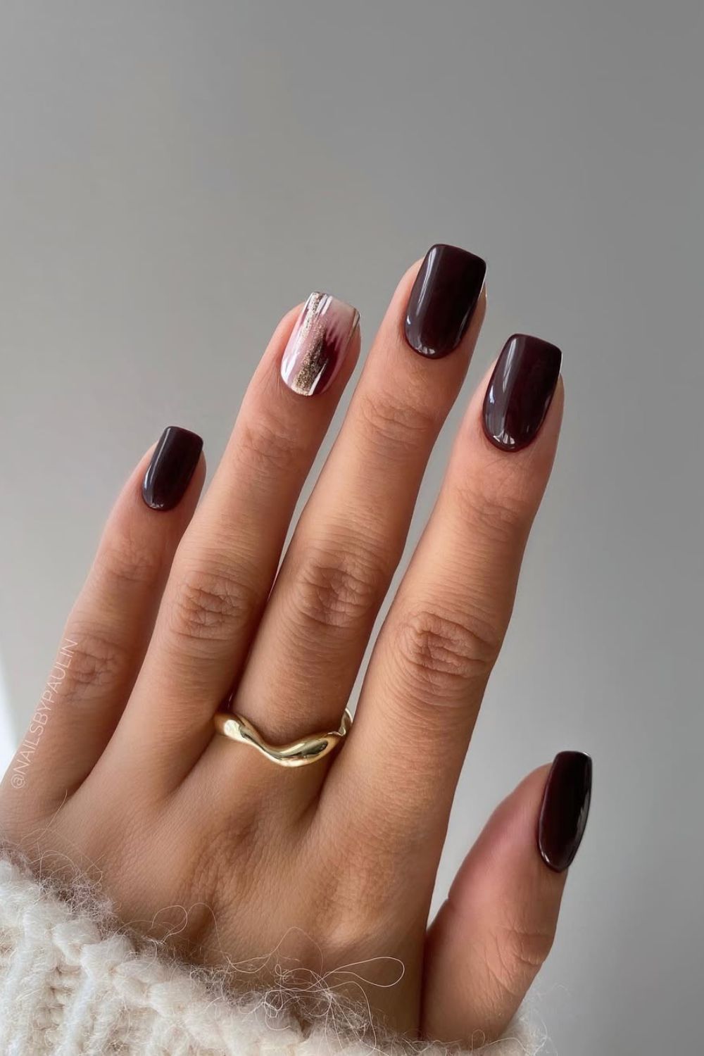 Dark brown nails with silver accent