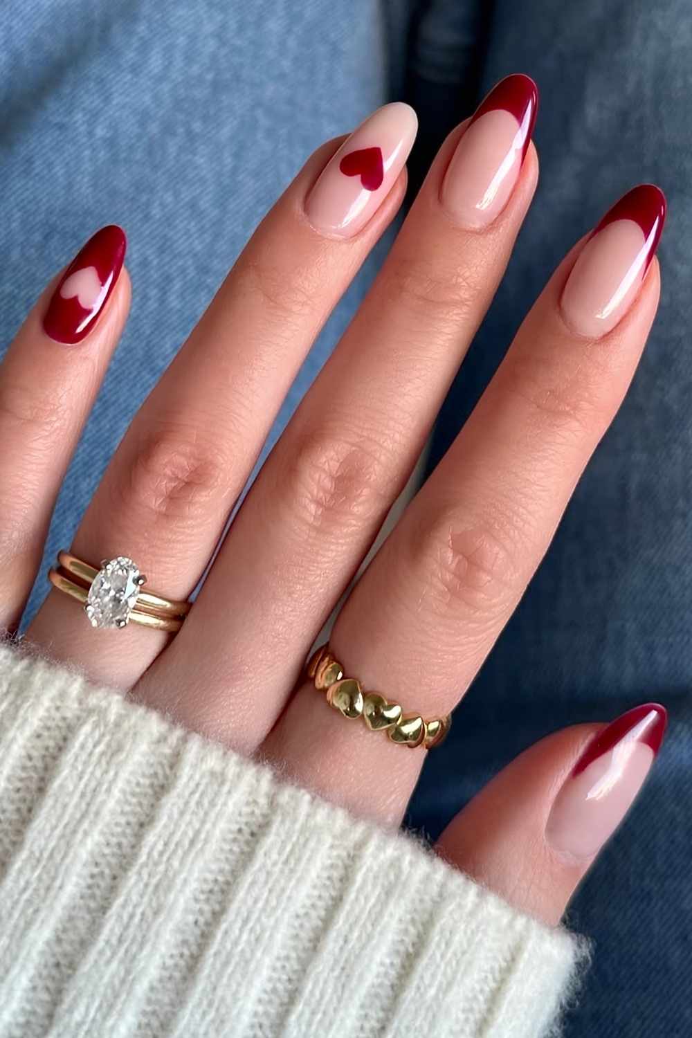 Dark red manicure with accent hearts