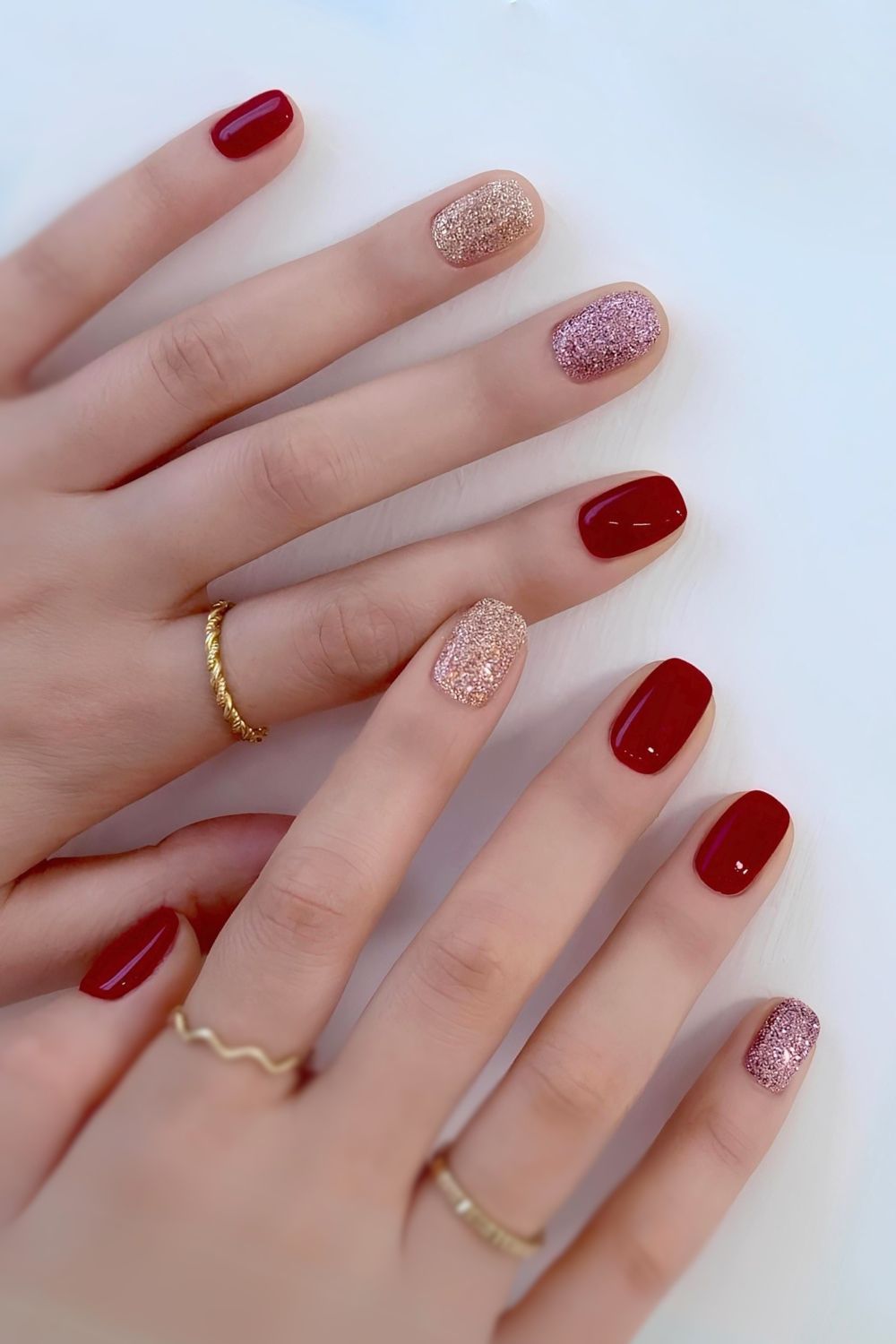 Dark red manicure with glitter accent nails