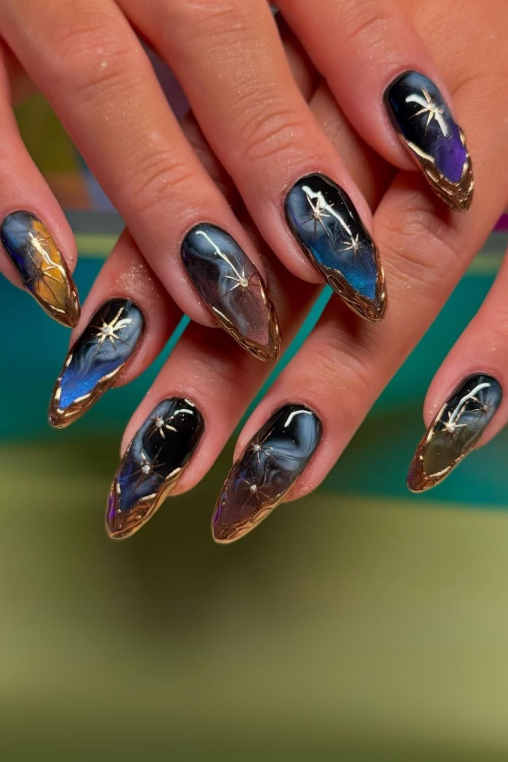 Dark shade nails with gold 3D chrome drips