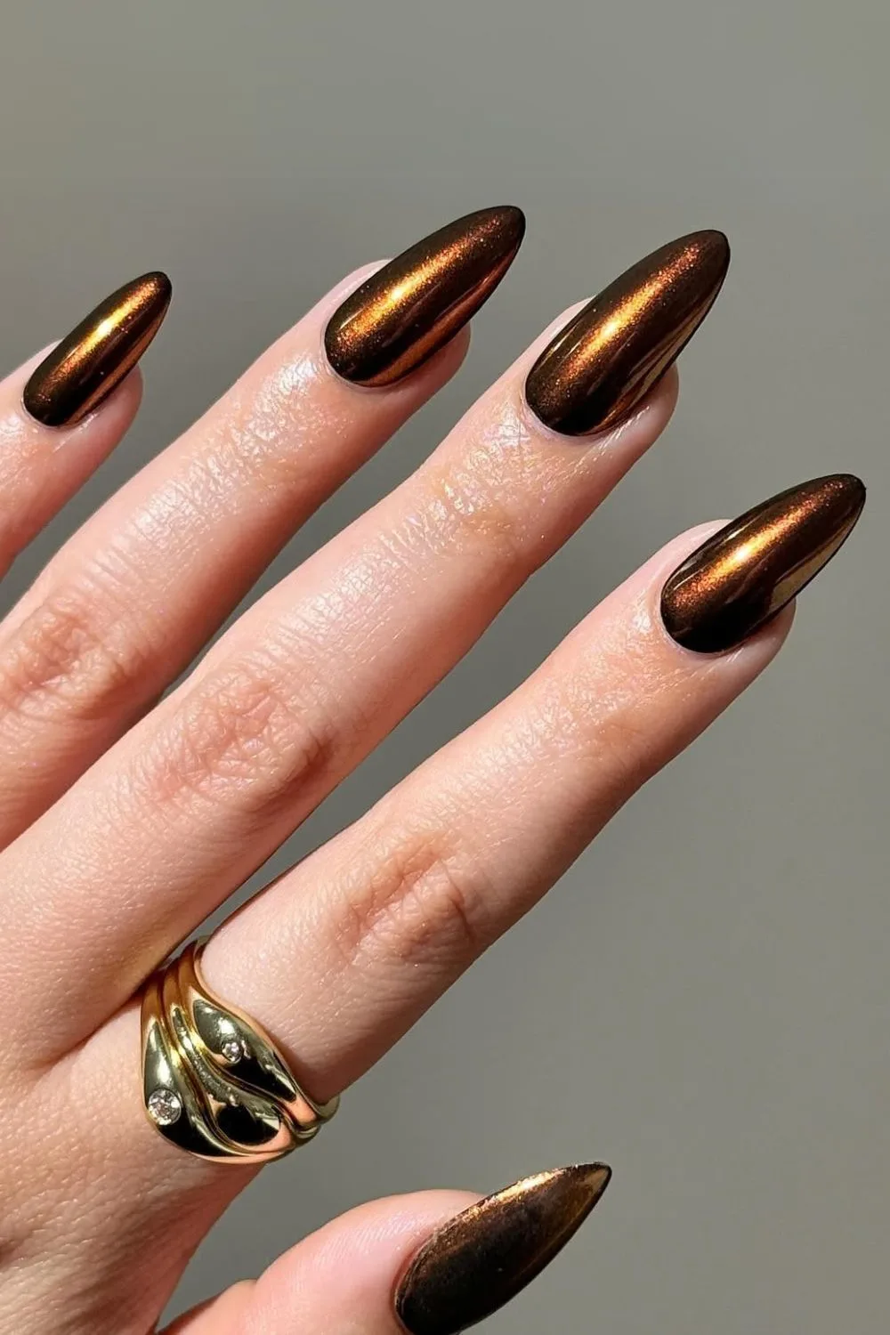 Deep bronze chrome nails with shimmer